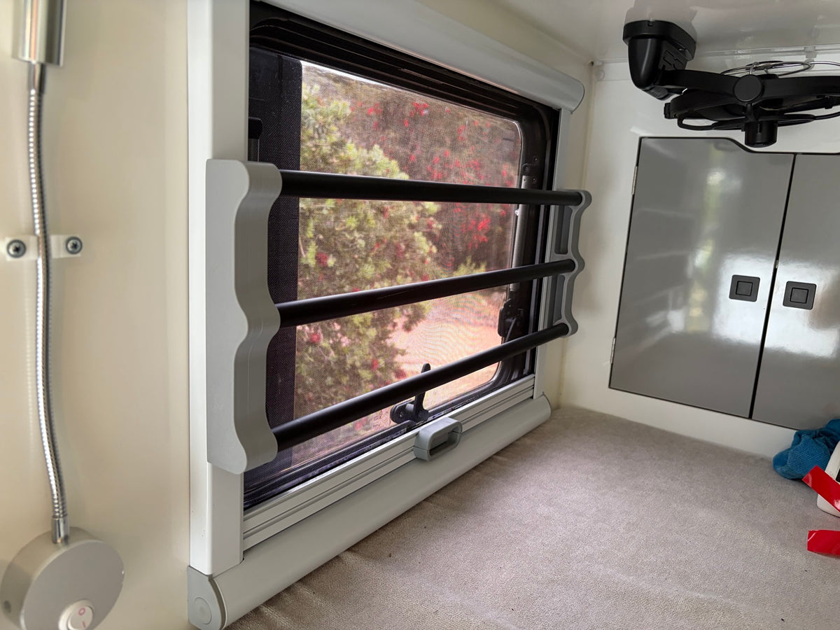 Blind protector and rods installed in caravan