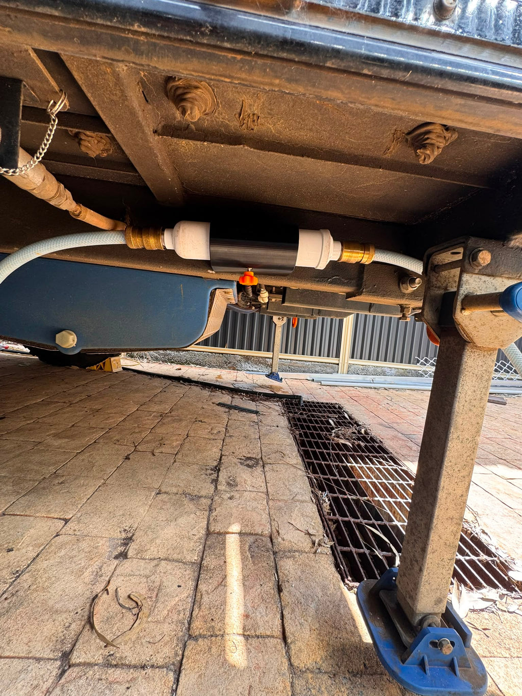 Water filter holder mounted under caravan