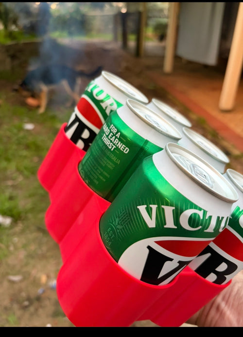 Red Hybrid Prints six-pack can organiser being held outdoors