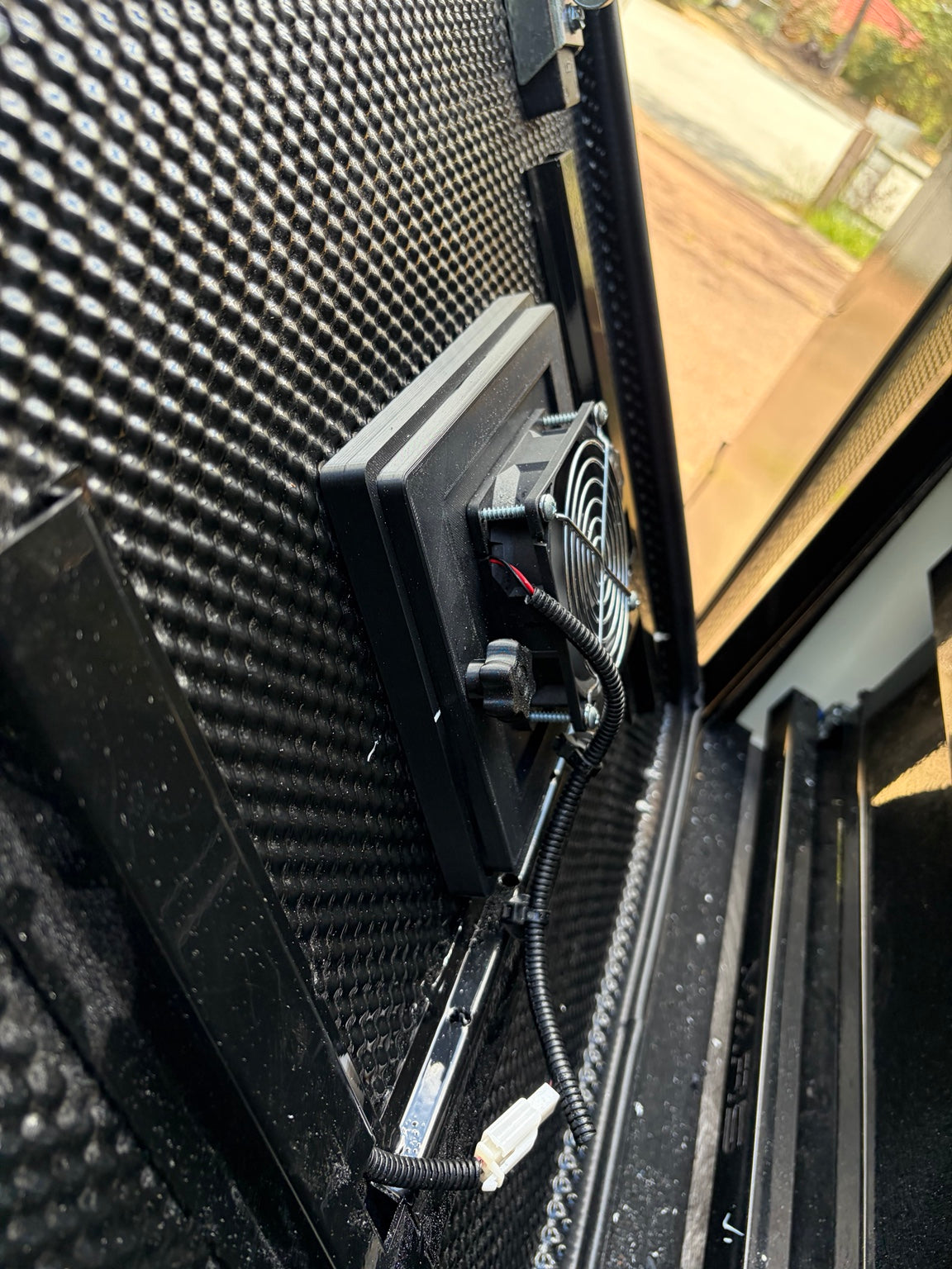 Inside view of optional fan assembly on caravan hatch