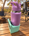 Mint green Hybrid Prints magnetic holder with a purple Yeti bottle at a campsite; bottle not included