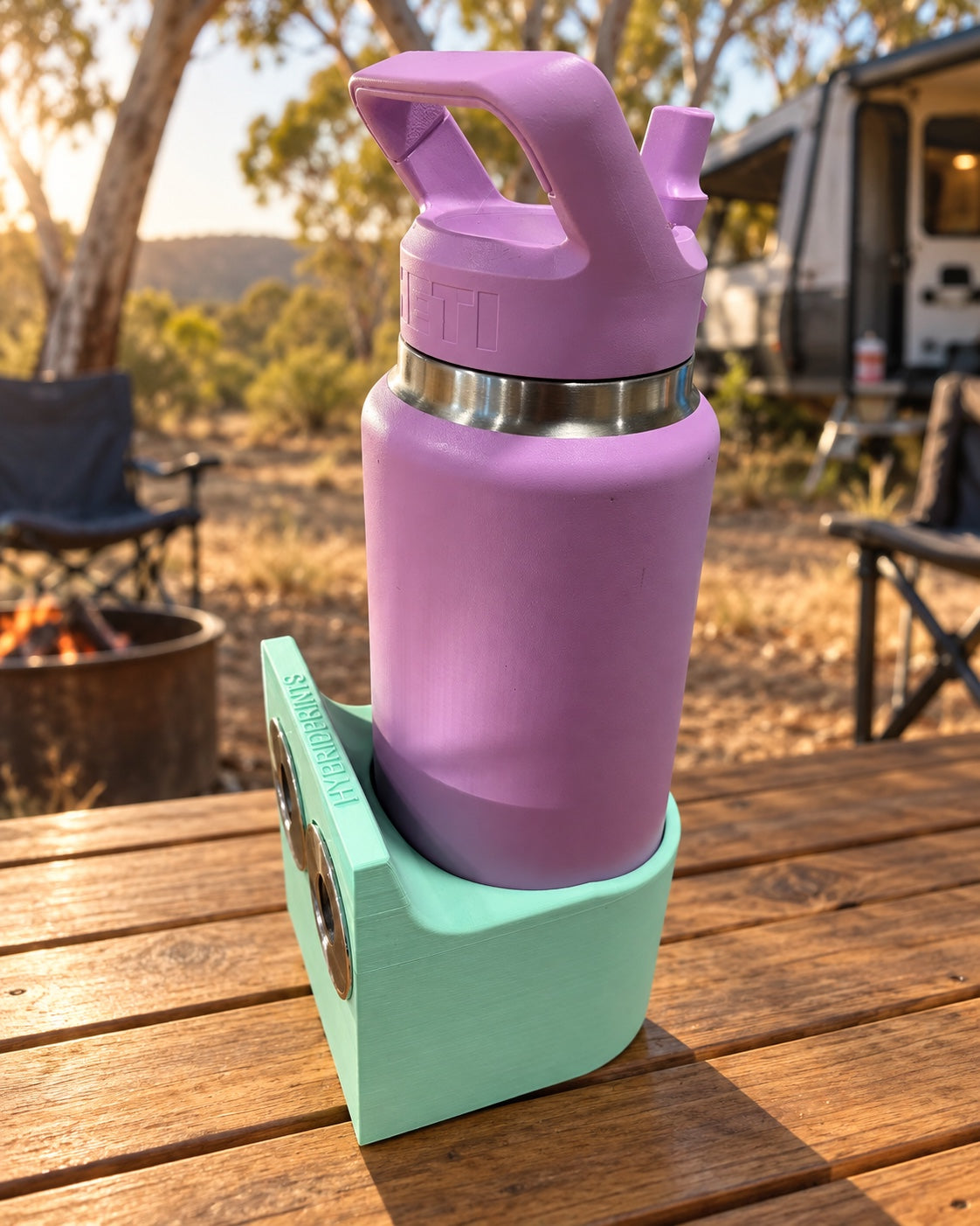Mint green Hybrid Prints magnetic holder with a purple Yeti bottle at a campsite; bottle not included
